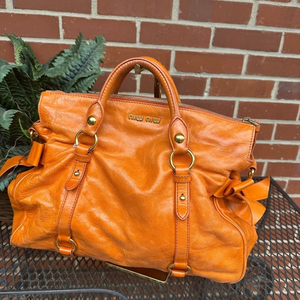 Miu Miu Vibrant Orange Satchel leather. Bows on side. Butter soft. Large